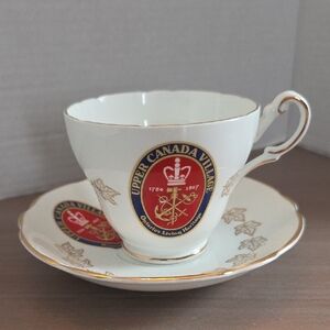 Royal Darwood cup and saucer feature a charming Village pattern